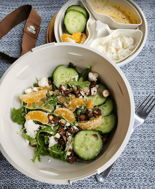 Zesty Arugula and Mandarin Orange Salad with Creamy Goat Cheese and Hazelnuts - Lotus Bowl